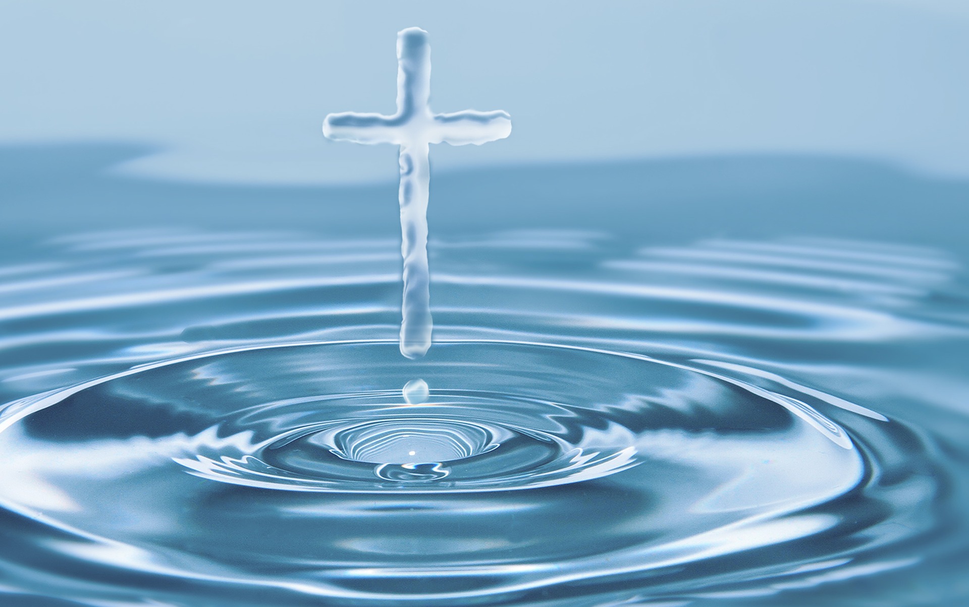 Cross formed by emerging from pool of water, symbolizing Christianity